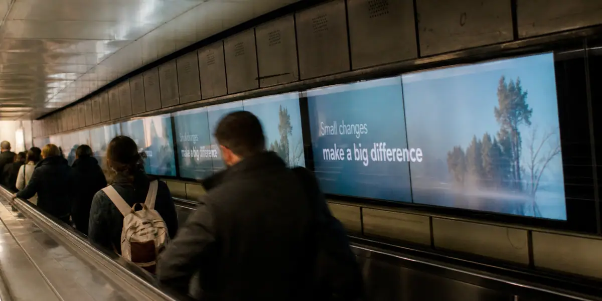 OOH advertising displays beside an escalator